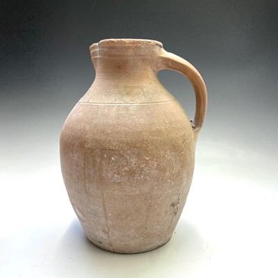 Lot 273 - A 19th century earthenware jug, height 34,...
