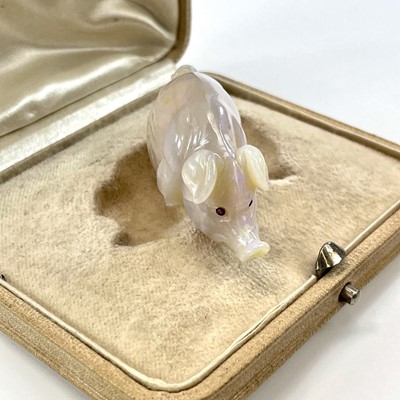 Lot 244 - An Imperial Russian carved opal pig, with...