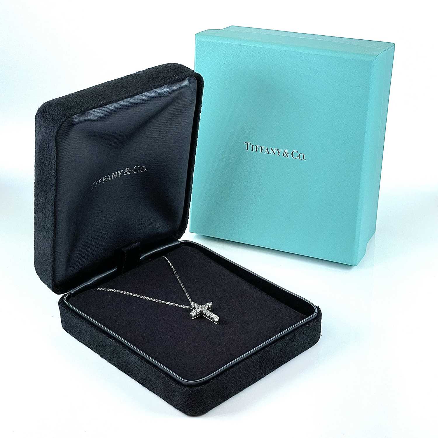 Lot 319 - A Tiffany & Co platinum and diamond set cross...