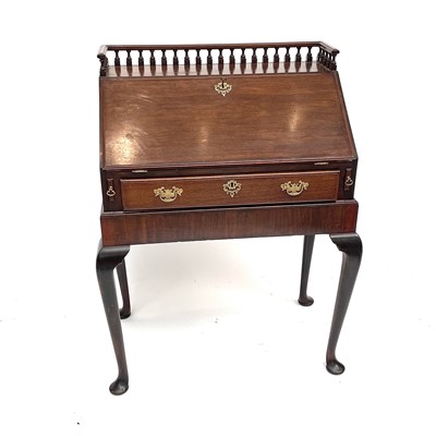 Lot 3049 - A George III style mahogany bureau on stand,...