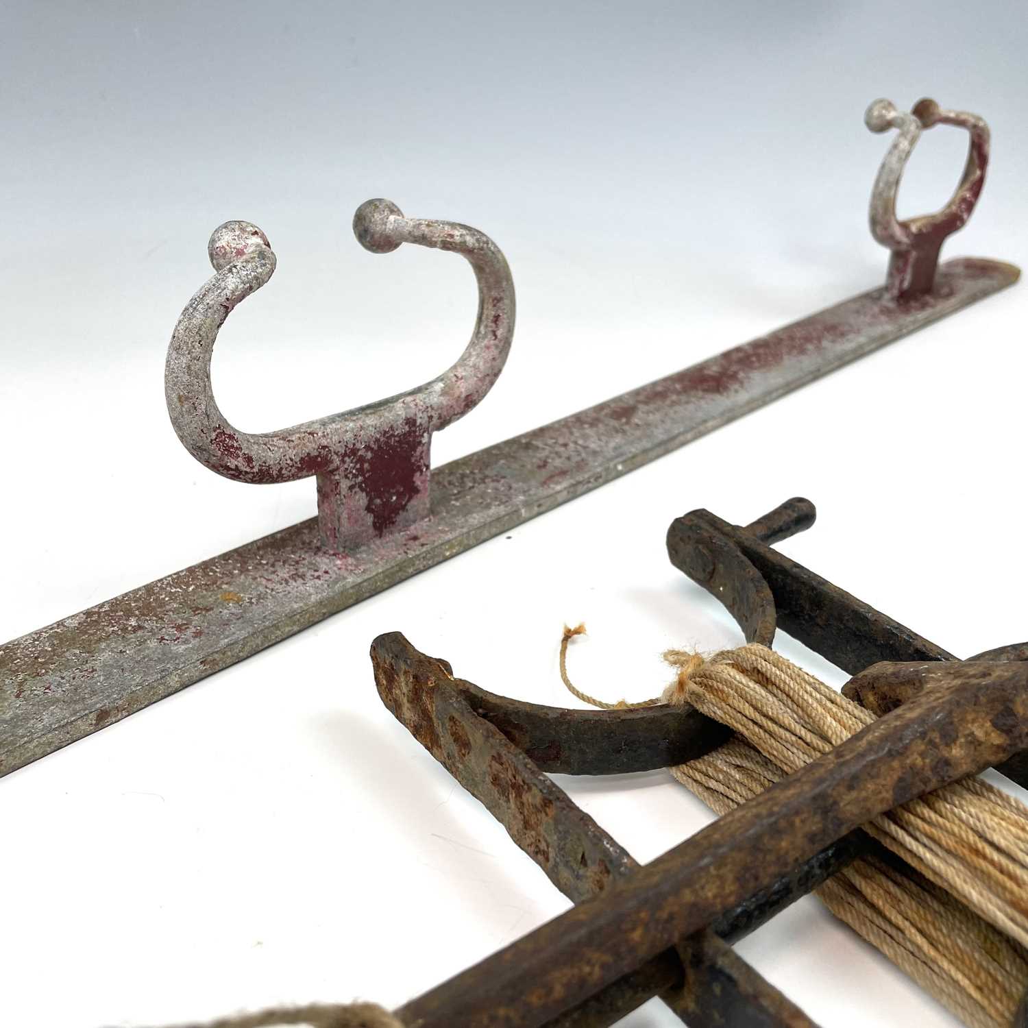 Lot 104 - A wrought iron garden string line and winder,