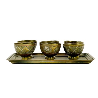 Lot 102 - A set of six Ottoman brass zarf cups.