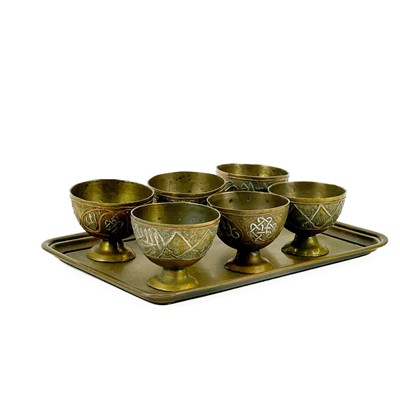 Lot 102 - A set of six Ottoman brass zarf cups.