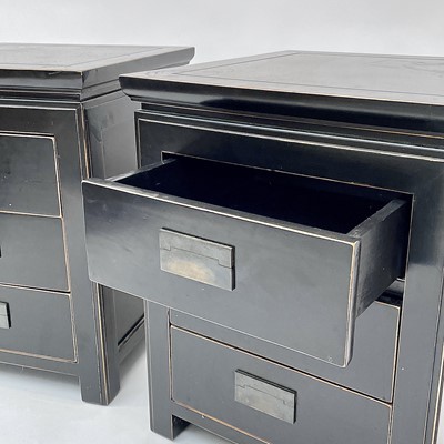 Lot 3045 - A pair of OKA black lacquered bedside chests,...