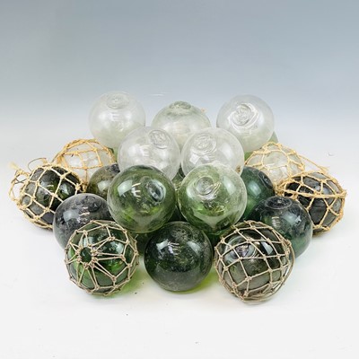 Lot 94 - A collection of glass floats including green...
