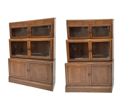 Lot 3019 - A pair of oak sectional bookcases, the 1930s,...