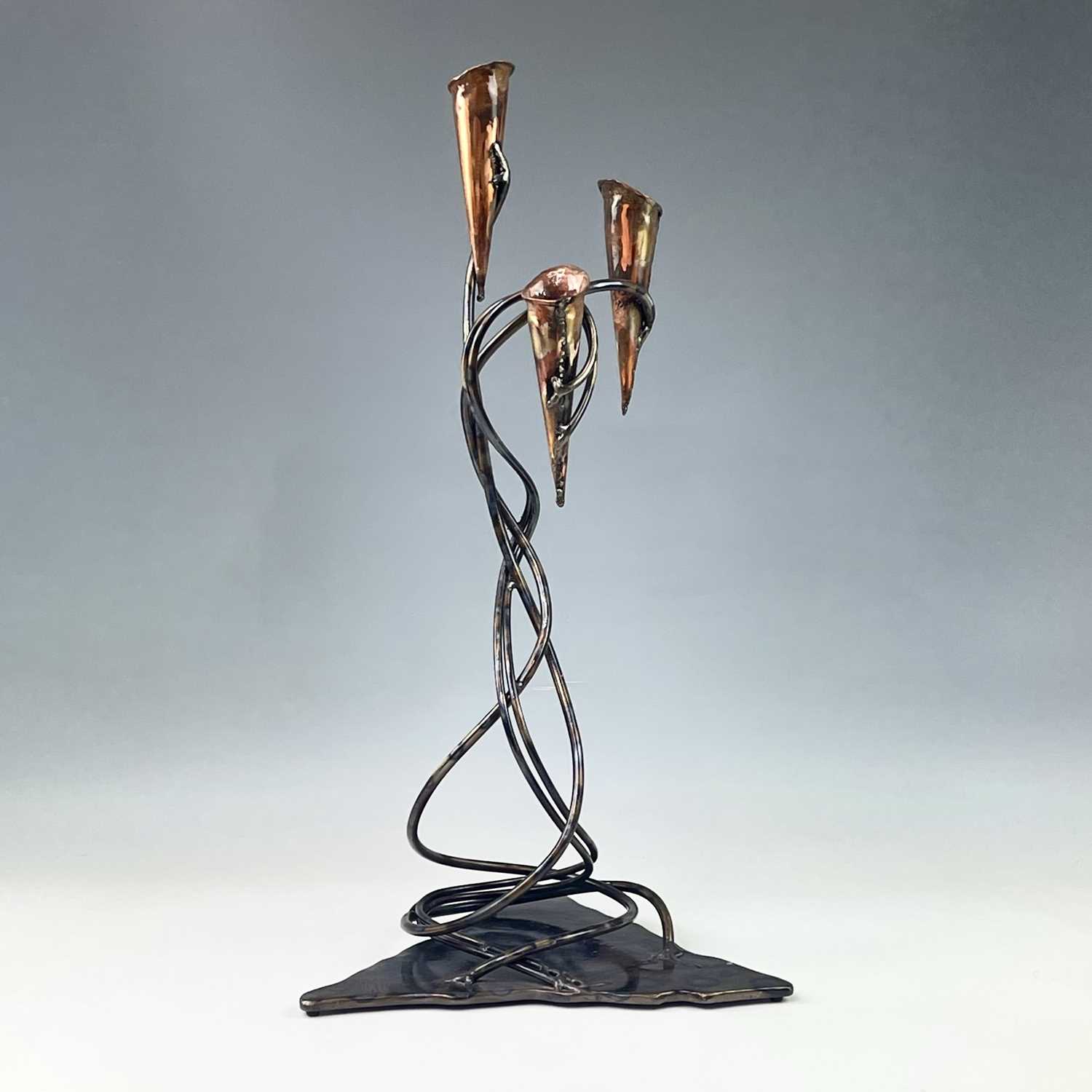 Lot 140 - Paul HOSKIN Copper candlestick with a tempered...