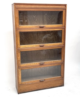 Lot 3022 - An oak glazed bookcase, 1930s, fitted with...