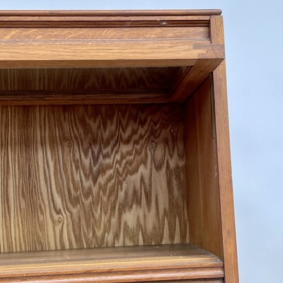 Lot 3022 - An oak glazed bookcase, 1930s, fitted with...