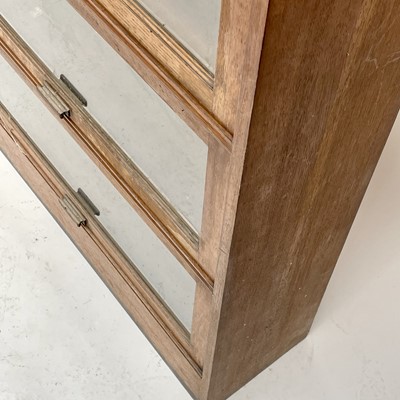 Lot 3022 - An oak glazed bookcase, 1930s, fitted with...