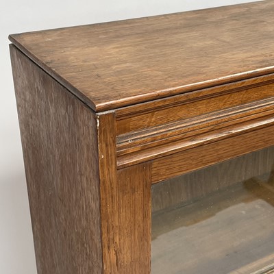 Lot 3022 - An oak glazed bookcase, 1930s, fitted with...