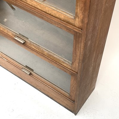Lot 3022 - An oak glazed bookcase, 1930s, fitted with...