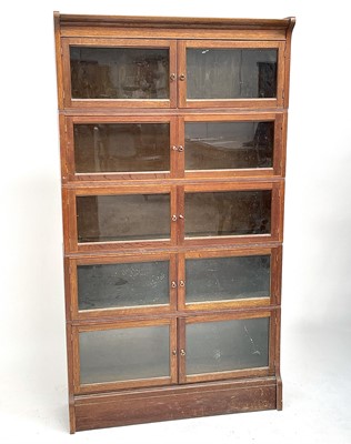 Lot 3023 - An oak sectional bookcase, mid 20th century,...