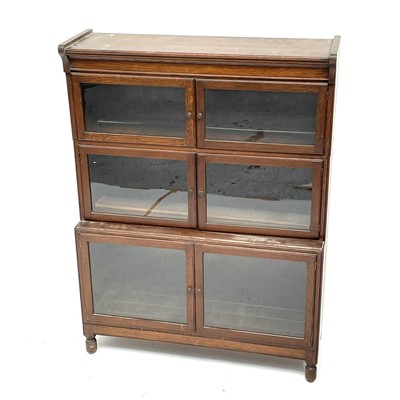 Lot 3024 - An oak sectional bookcase, early 20th century,...