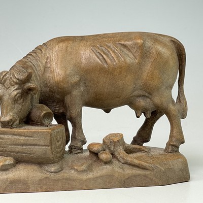 Lot 33 - A Continental linden wood carving of a cow at...