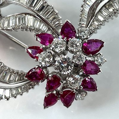 Lot 124 - A stylish mid-century diamond and ruby brooch,...