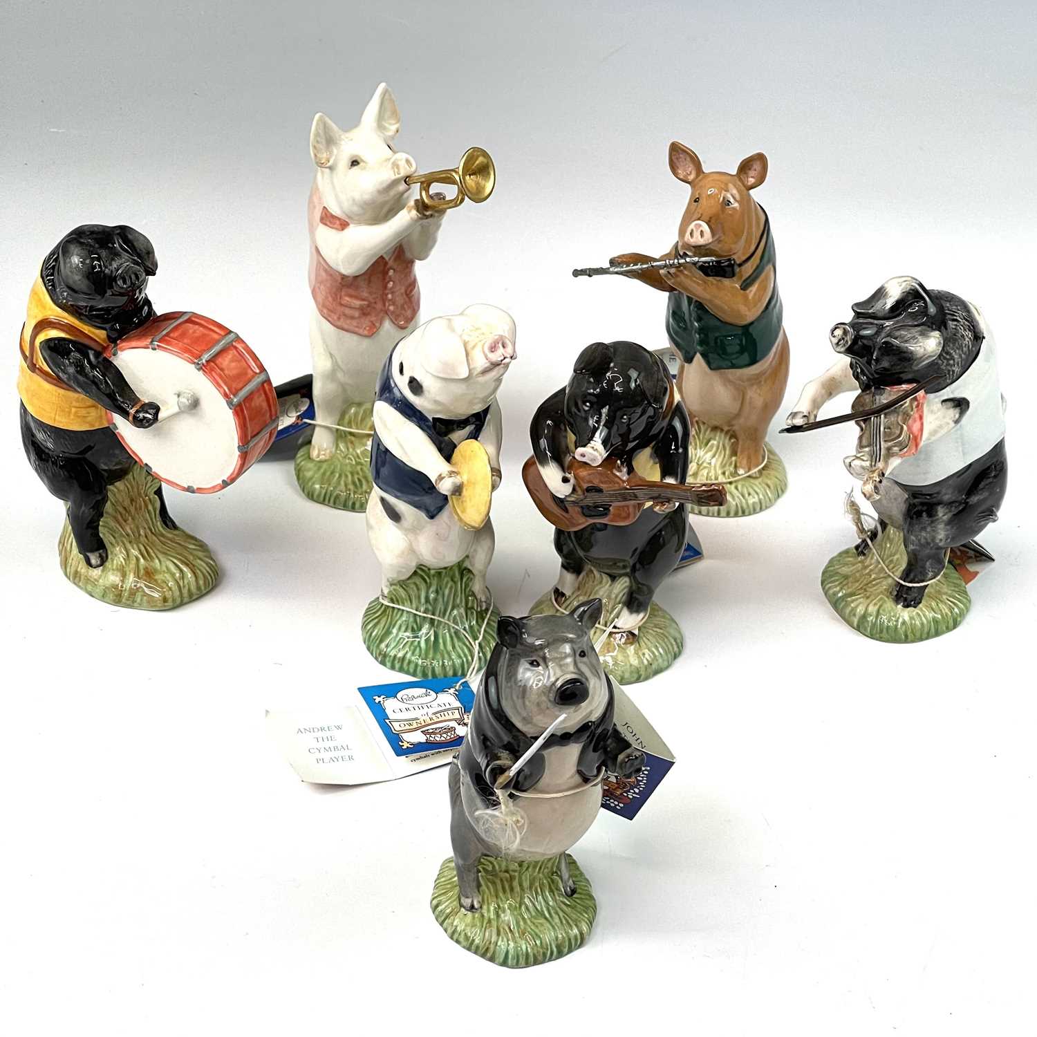 Lot 995 - A collection of seven Beswick pottery pig band...