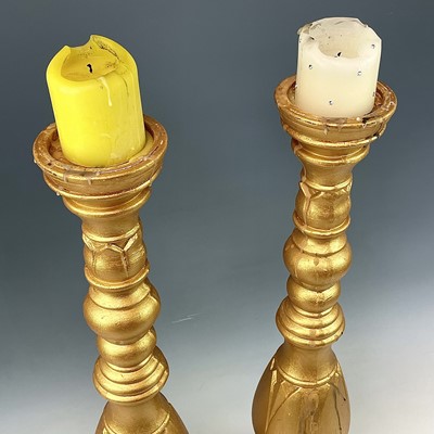 Lot 150 - A pair of large gold painted candle stands,...
