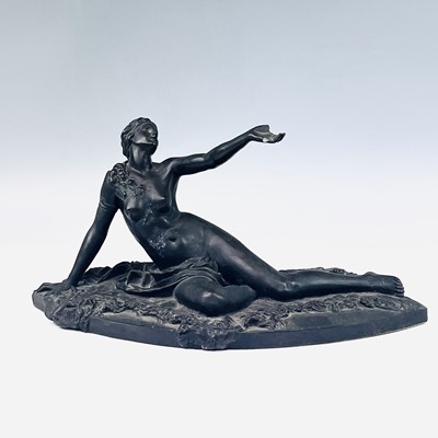 Lot 196 - A resin cast of a neo classical reclining...