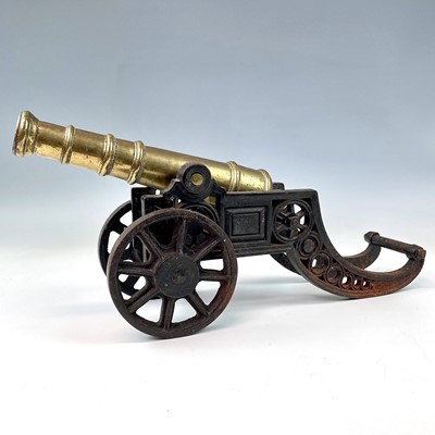 Lot 136 - A brass and cast iron model of a cannon,...