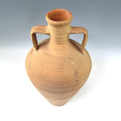 Lot 197 - 1: A terracotta twin handled storage jar,...