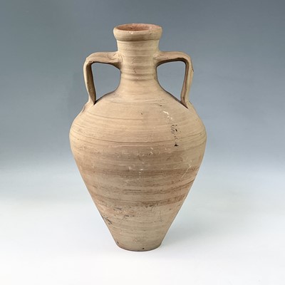 Lot 197 - 1: A terracotta twin handled storage jar,...