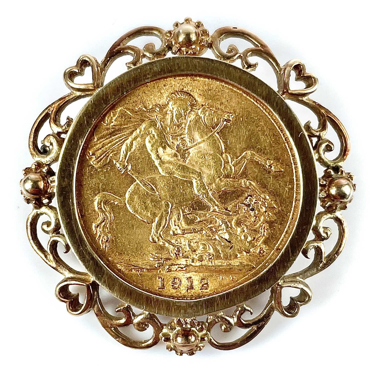 Lot 222 - A George V 1912 full sovereign coin pendant in...