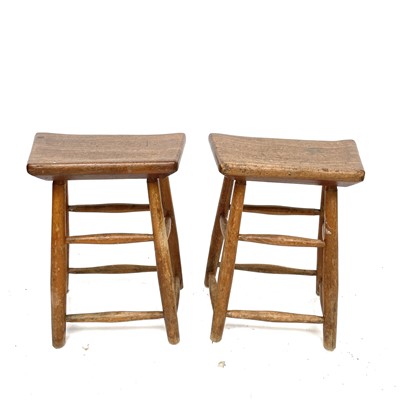 Lot 3082 - A pair of teak laboratory type stools,...