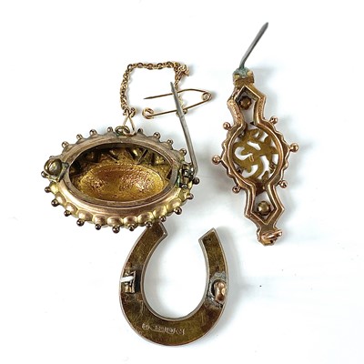 Lot 126 - Three 9ct gold brooches with base metal pins,...