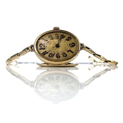 Lot 379 - A 1930's 14ct gold ladies manual wind bracelet...