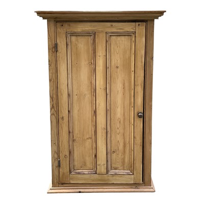 Lot 3096 - A pine cupboard, with a twin panelled door...