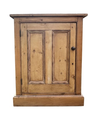 Lot 3097 - A pine cupboard, with a twin panelled door...