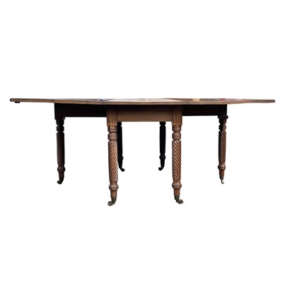 Lot 3099 - A Regency mahogany drop leaf dining table,...