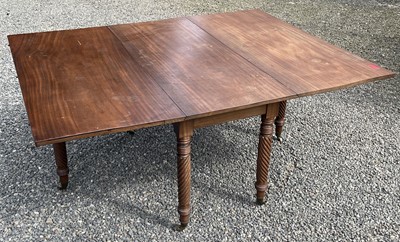 Lot 3099 - A Regency mahogany drop leaf dining table,...