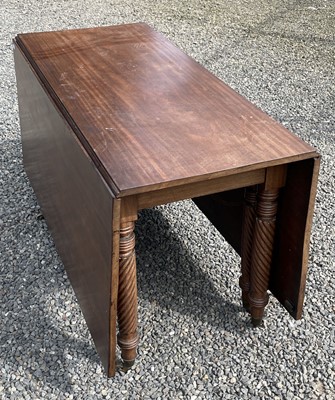 Lot 3099 - A Regency mahogany drop leaf dining table,...