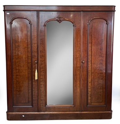 Lot 3103 - A Victorian mahogany triple wardrobe, with...