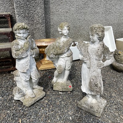 Lot 617 - A set of three reconstituted stone figures...