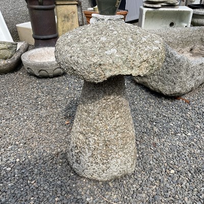 Lot 618 - A granite staddle stone on a typical tapered...