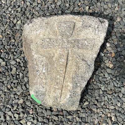 Lot 625 - A small block of granite carved with a Celtic...