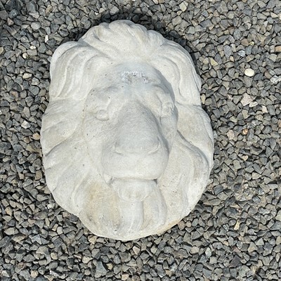 Lot 626 - A reconstituted stone lion mask, height 38cm.