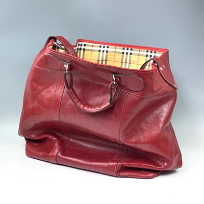 Lot 2916 - An oversized red leather bag with haymarket...