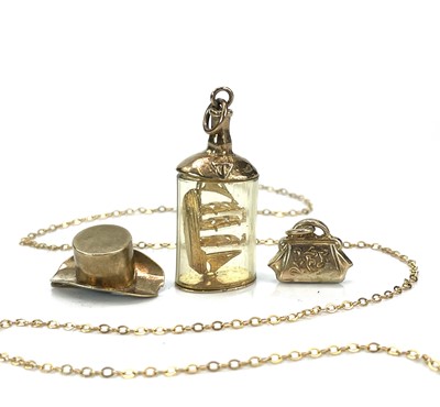 Lot 119 - A 9ct hallmarked gold ship in a bottle charm,...