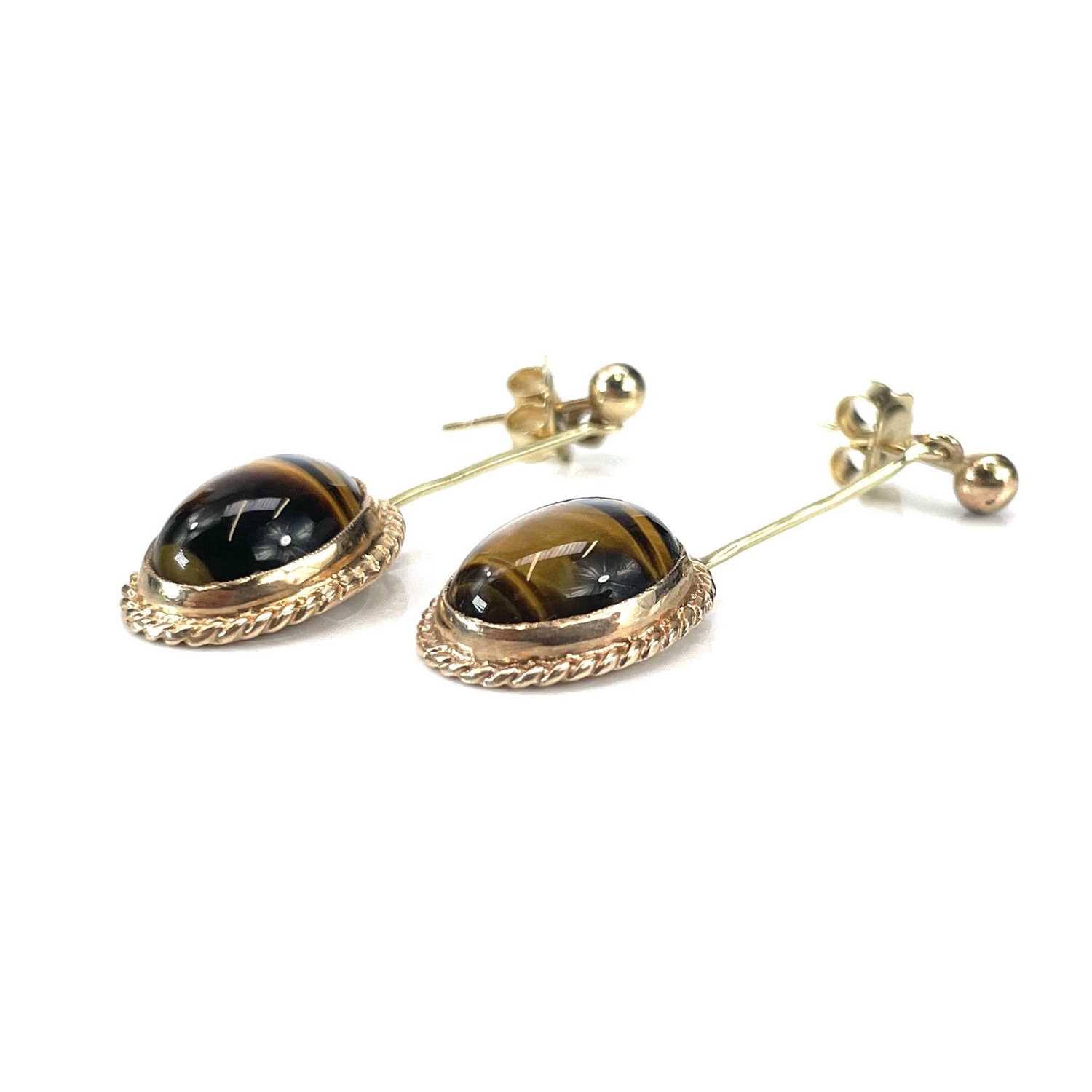 Lot 190 - A pair of gold tigers eye set pendant stud...
