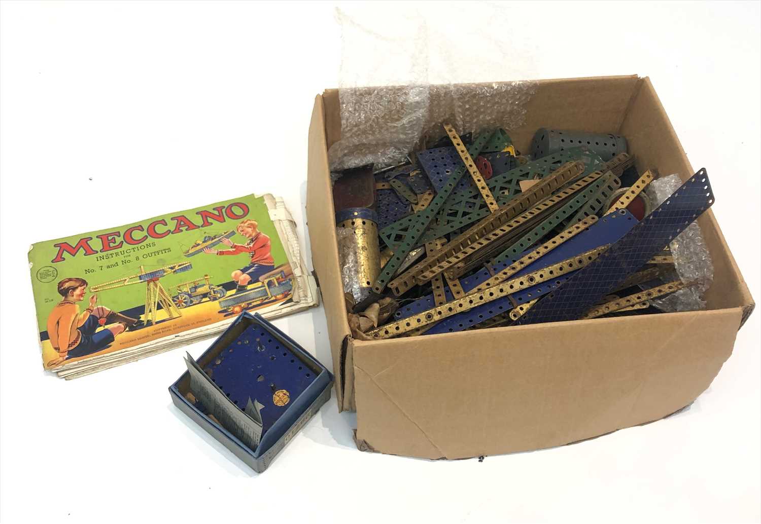 Lot 586 - Meccano - a quantity of blue and gold pieces...