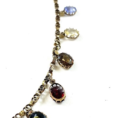 Lot 58 - A gold multiple specimen gem set necklace, the...