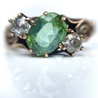 Lot 14 - A gold diamond and green tourmaline three...