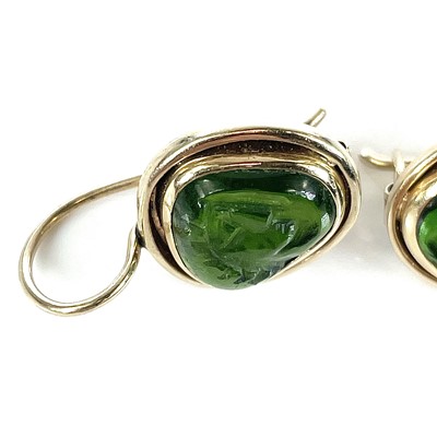 Lot 113 - A pair of gold and carved green stone earrings,...