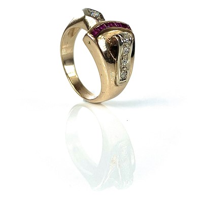 Lot 167 - A 14k gold ruby and diamond ring.