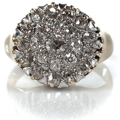 Lot 71 - A 14k gold diamond cluster ring, the circular...