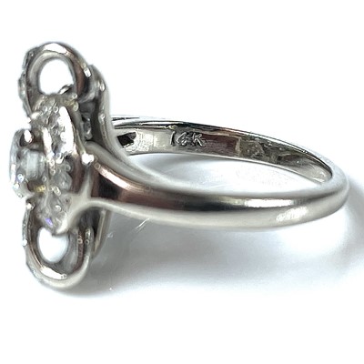 Lot 110 - A 14k white gold diamond dress ring of floral...